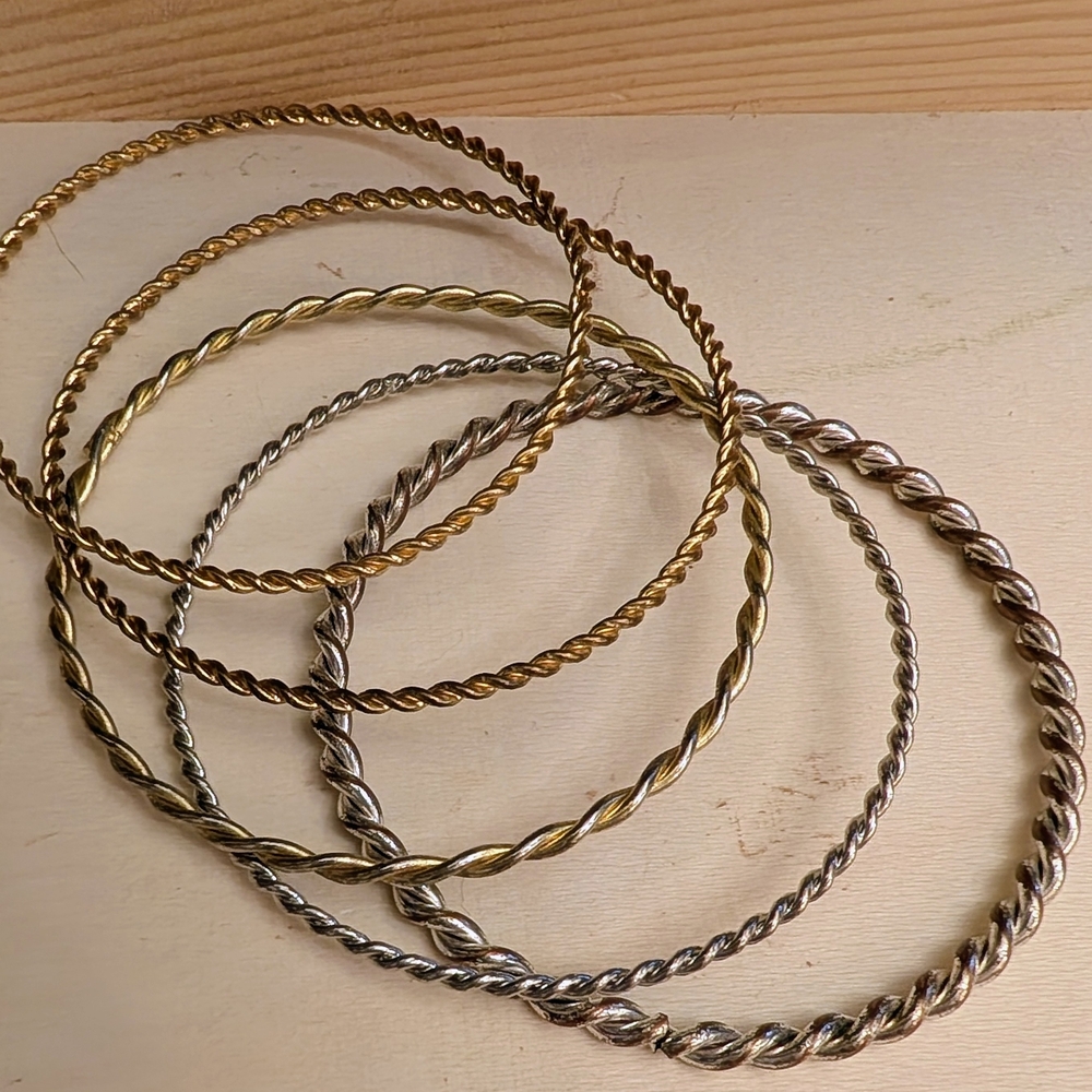 Source Unknown Gold and Silver Twisted Bracelets